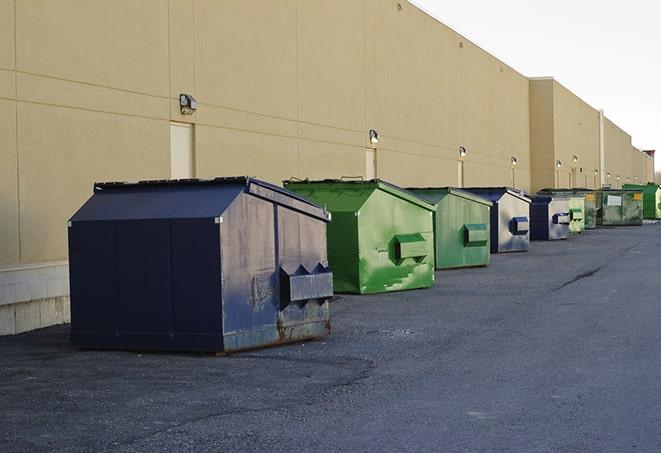 dumpsters with safety cones in a construction area in Ashland